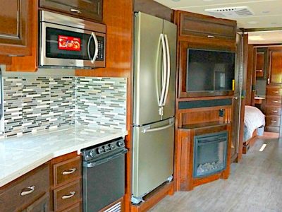 RV with a residential fridge in the kitchen