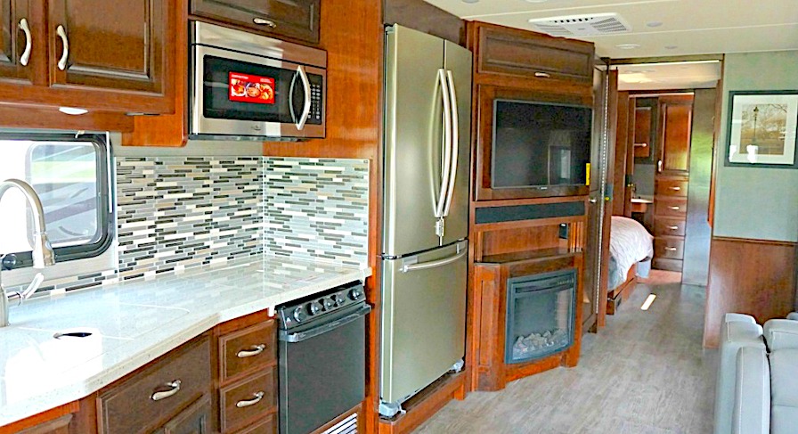RV with a residential fridge in the kitchen