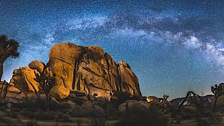 Rock formation under the milky way galaxy at night in Joshua Tree National Park
