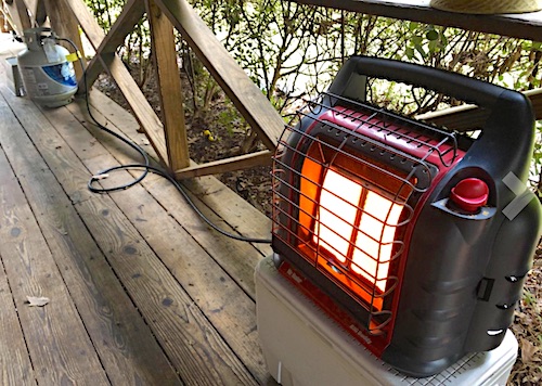 Propane heater with adapter connected to 20 gallon propane tank