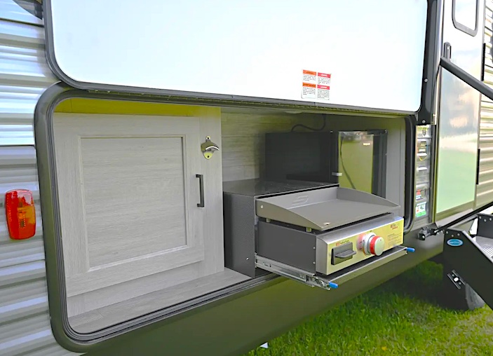 camper trailer with an outside camp kitchen