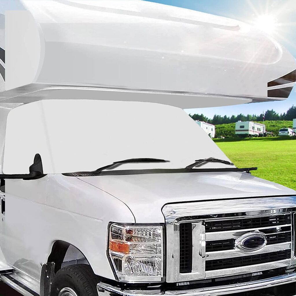 White window cover on front windshield of RV