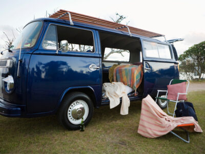 Blue Volkswagon camper van with side door open