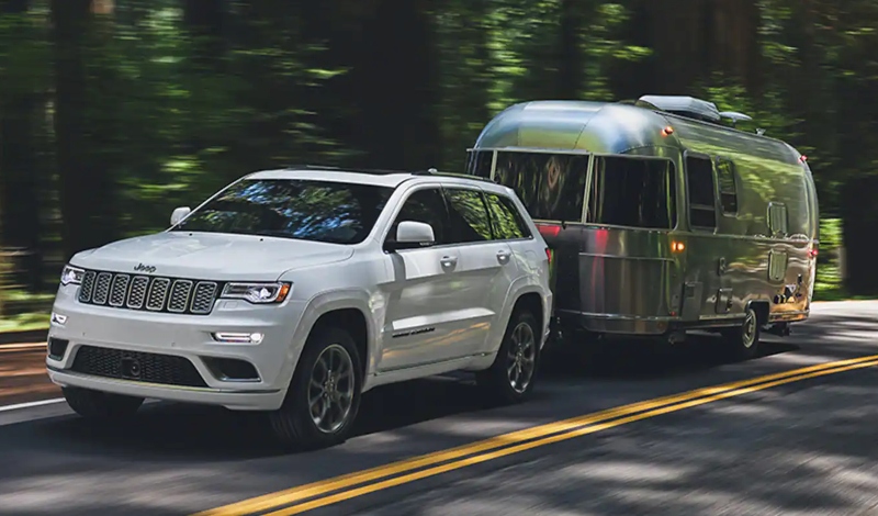 Consider What is Inside the Best SUV for Towing a Camper Jeep Grand Cherokee towing Airstream Caravel