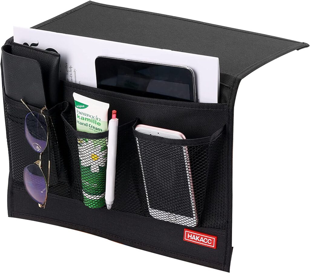 Ultimate Gift Guide for RV Owners includes this black bedside caddy with pockets to hold books etc