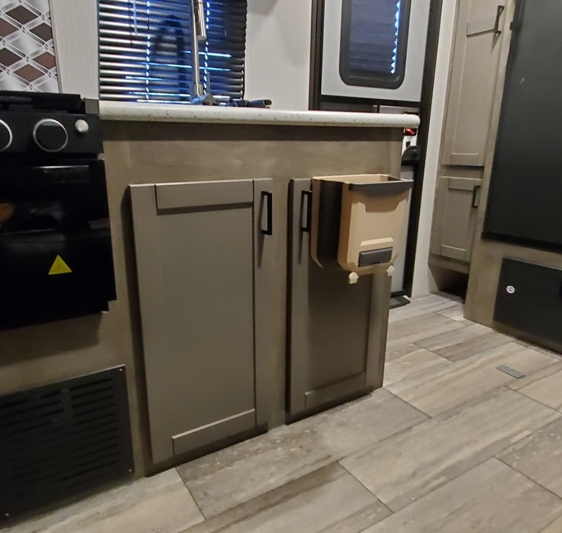 Organization Hacks for Your RV Mount Your Garbage Can to a Door