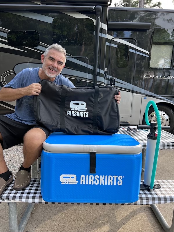 Mike from RVBlogger sitting with his AirSkirts inflatable cooler