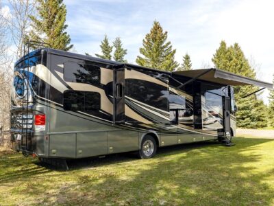 Class A Motorhome parked with slides out at a campground