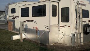Travel trailer with foam board insulation skirting