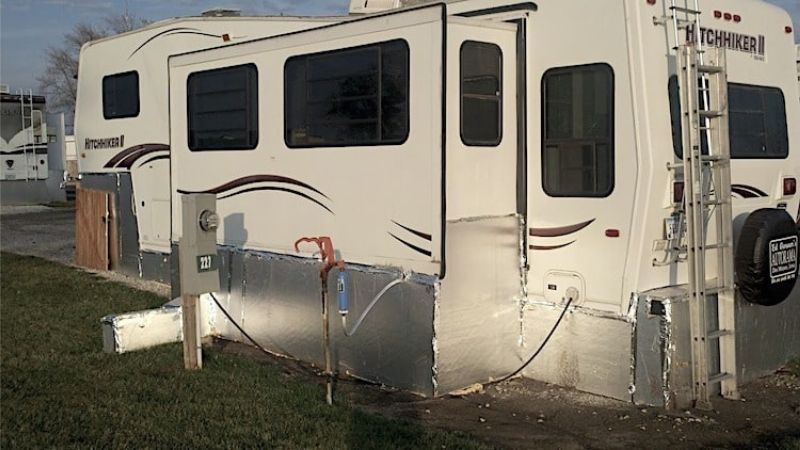 Travel trailer with foam board insulation skirting