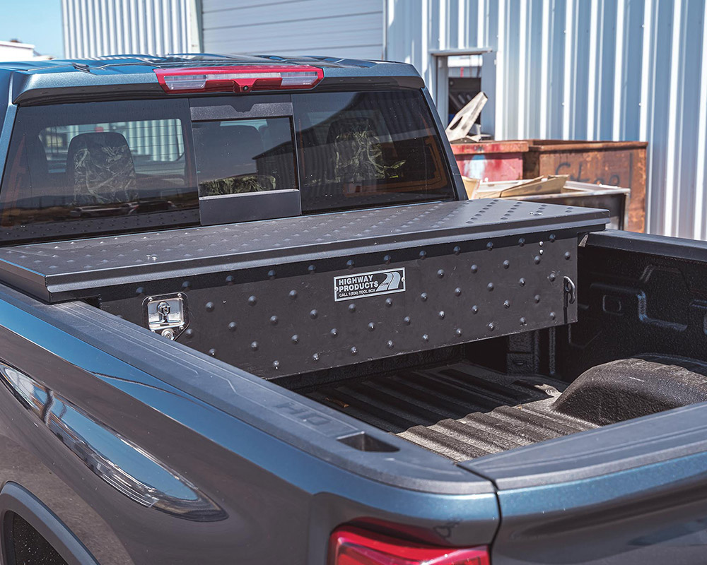 Truck with a tool box mounted at the front of the bed - 5th wheel truck bed storage
