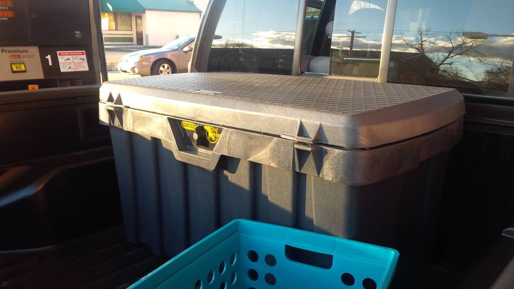 Large plastic storage tote in bed of a truck - 5th wheel truck bed storage
