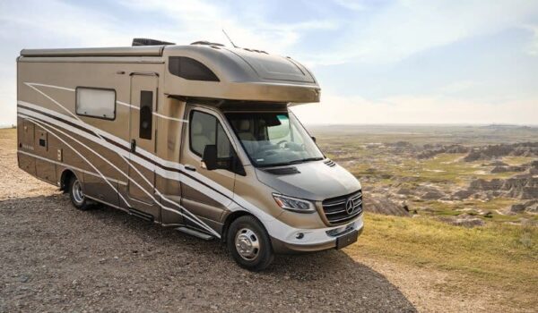 Mercedes motorhome parked overlooking a valley