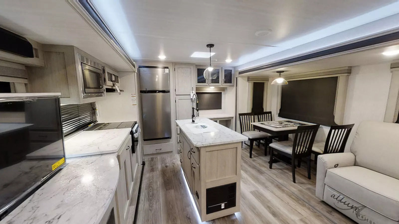 2024 East To West Alta 2810 KIK is one of the best travel trailer RVs with office space at rear of trailer which includes a desk and file cabinet.