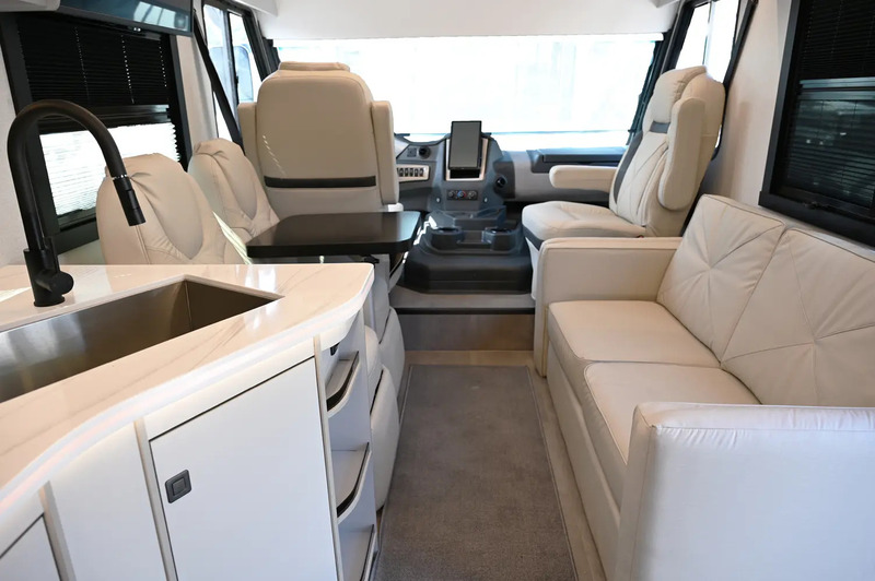 Coachmen Euro 25EU interior with tan furniture
