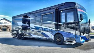 Newmar Dutch Star Class A Motorhome with black blue and white graphics at a Blue Compass Dealership
