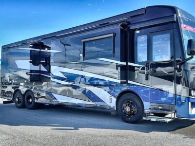 Newmar Dutch Star Class A Motorhome with black blue and white graphics at a Blue Compass Dealership