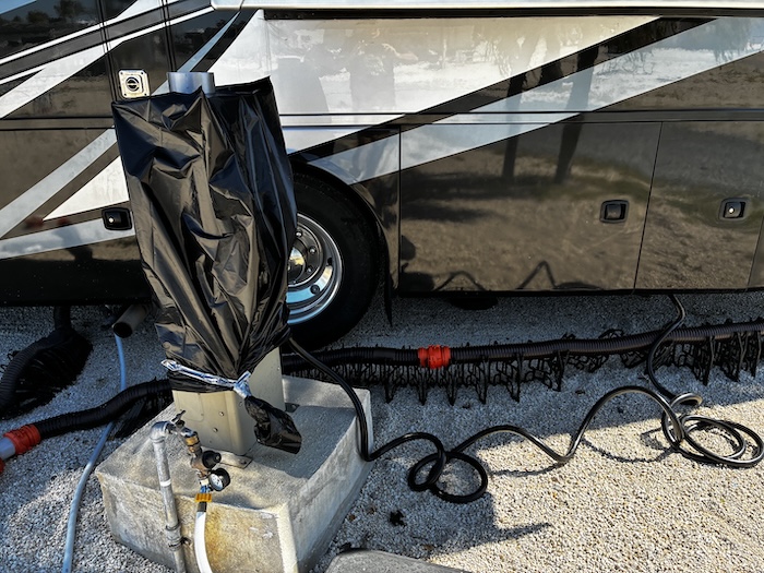 my electric pedestal at a campground covered in a big green trash bag and duct taped at the bottom.