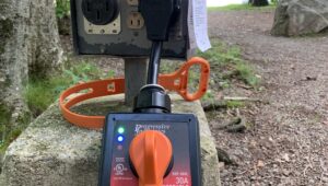 RVBlogger surge protector plugged into an electric pedestal