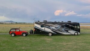2021 Thor challenger towing our red 2 door jeep