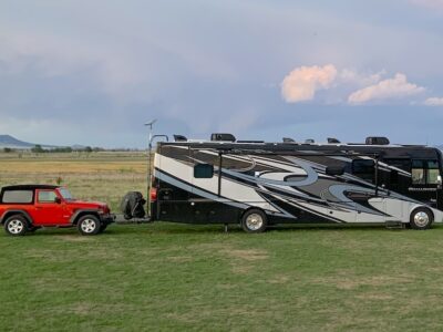 2021 Thor challenger towing our red 2 door jeep